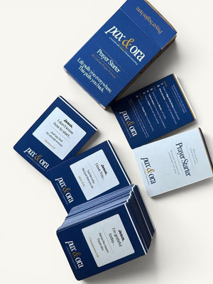 Catholic Prayer Prompts — Pax & Ora Prayer Starter Pack, 60 cards with prompts for honest prayer, on a wooden surface.