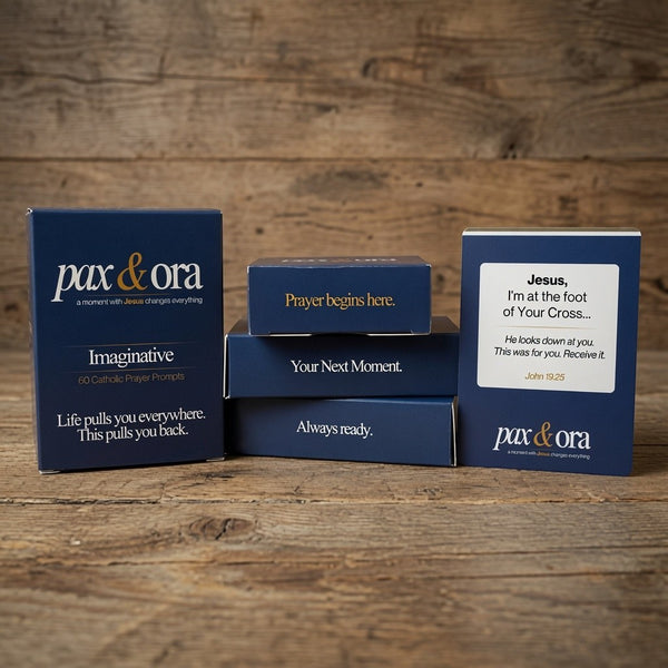 Catholic Prayer Cards — Pax & Ora Imaginative Prayer Pack featuring navy blue boxes with white text on wood background.