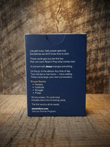 Catholic Prayer Cards — Pax & Ora Prayer Starter Pack box with navy blue matte finish on a rustic wooden surface.