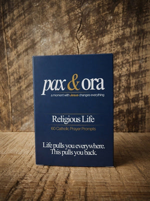 Catholic Prayer Cards — Pax & Ora religious life deck in a navy blue tuck box with white and gold text.