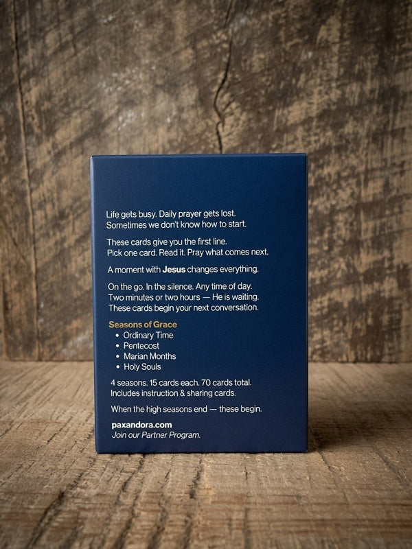 Catholic Prayer Cards — Pax & Ora Seasons of Grace deck in a navy blue box with white text on a rustic wood surface.