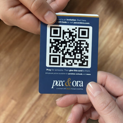 Catholic evangelization cards Pax and Ora Share Pack — prayer card held in hand
